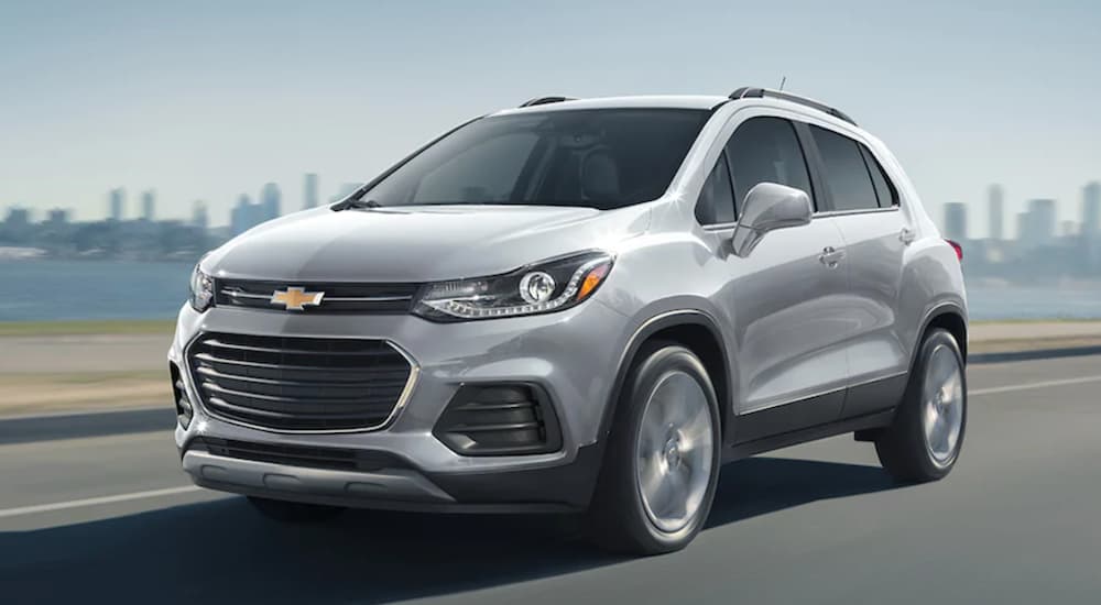 A silver 2021 Chevy Trax is shown driving from a Chevy dealer near Port Huron.