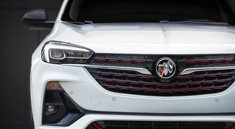 A close-up on the hood of a white 2024 Buick Encore GX.