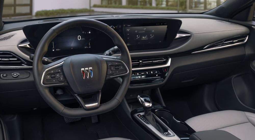 A clack up shows the black dash and infotainment screen in a 2024 Buick Envista Avenir.