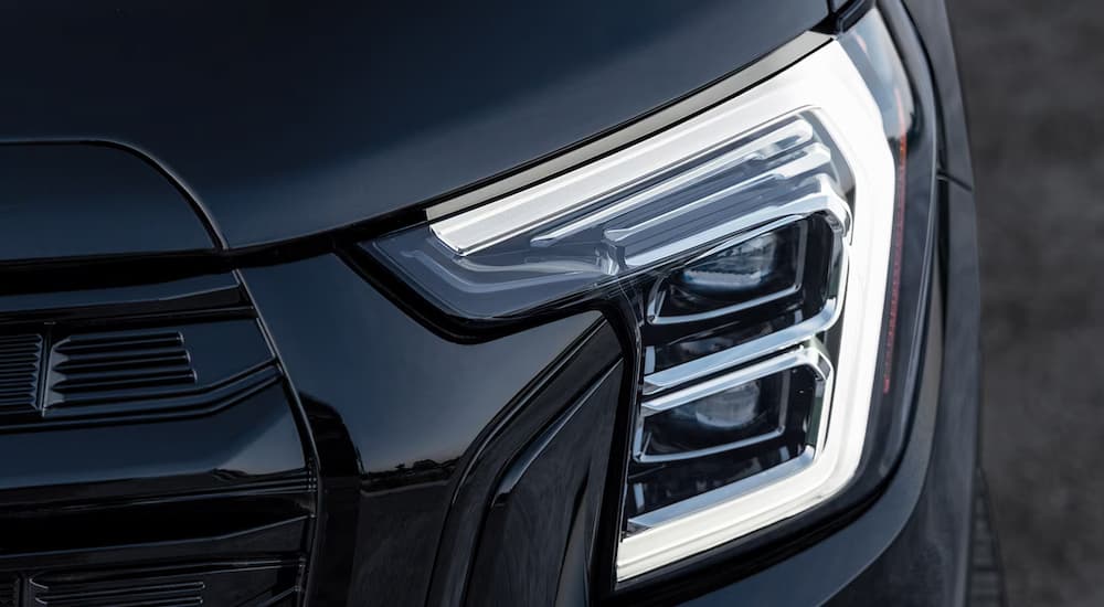 Headlight on a black 2025 GMC Terrain for sale.