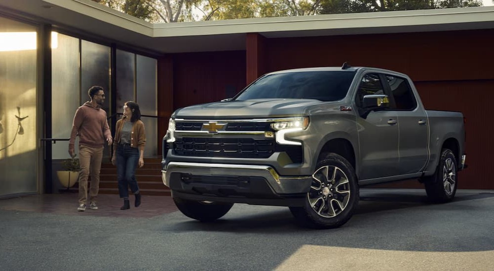 A silver 2026 Chevy Silverado LT Z71 parked on a driveway.