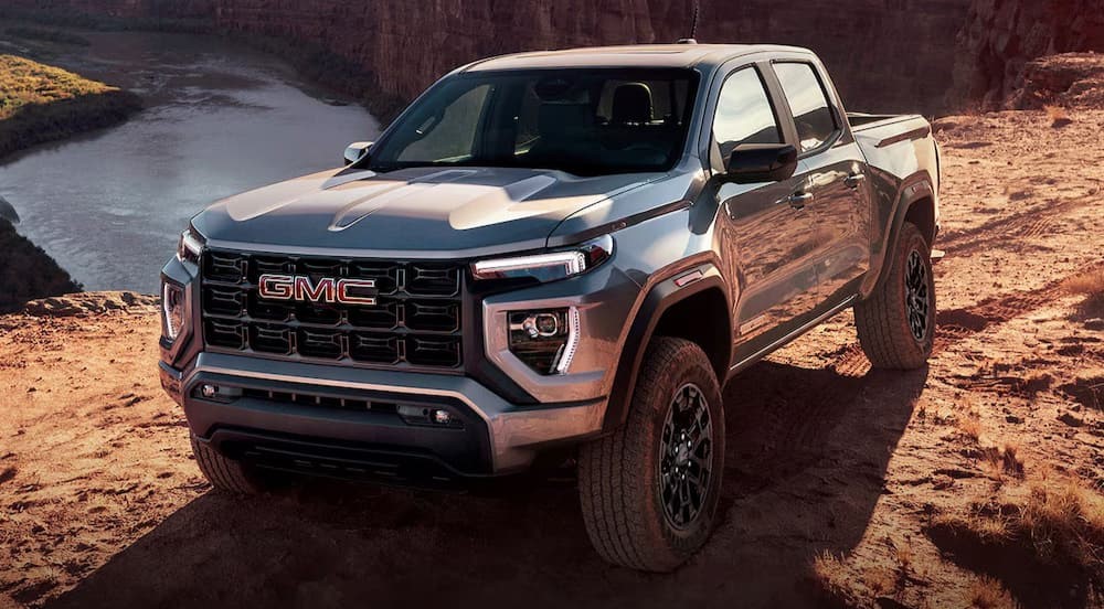 A silver 2026 GMC Canyon Elevation parked off-road.