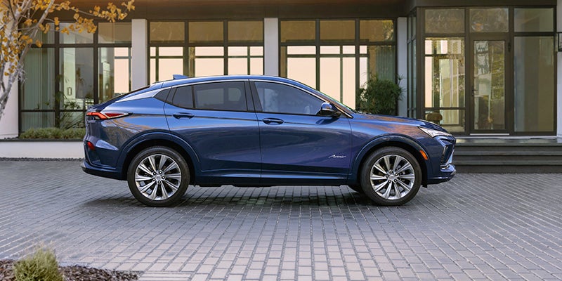 A blue 2024 Buick Envista parked on a driveway.