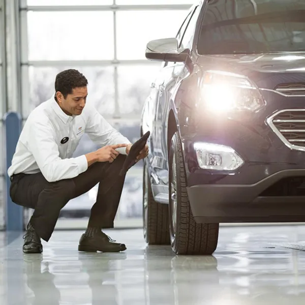 image of a man holding a tablet