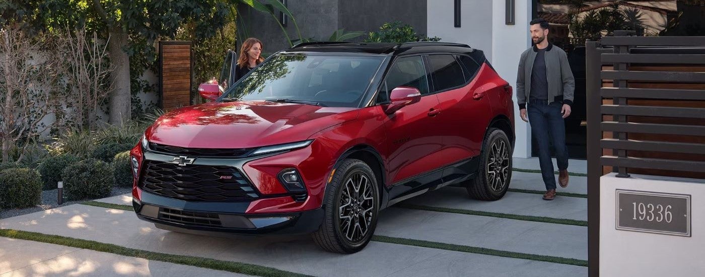 Red 2026 Chevy Blazer parked on a driveway.