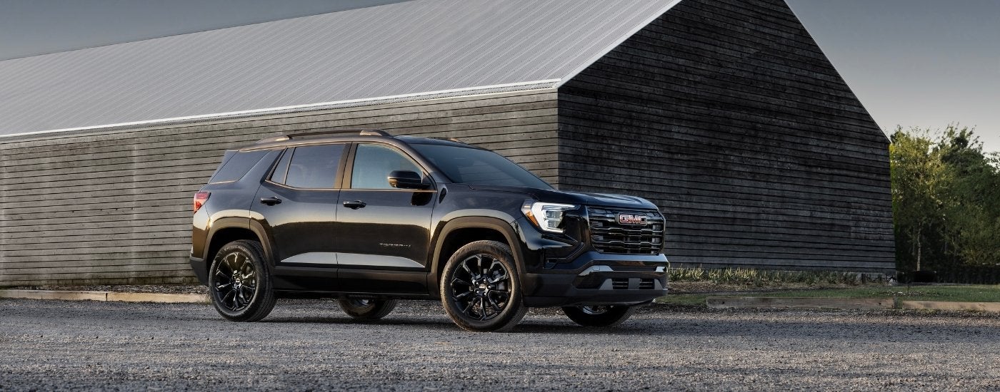 A black 2025 GMC Terrain from the side.