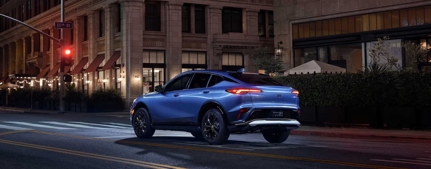 Blue 2026 Buick Envista driving down a city street