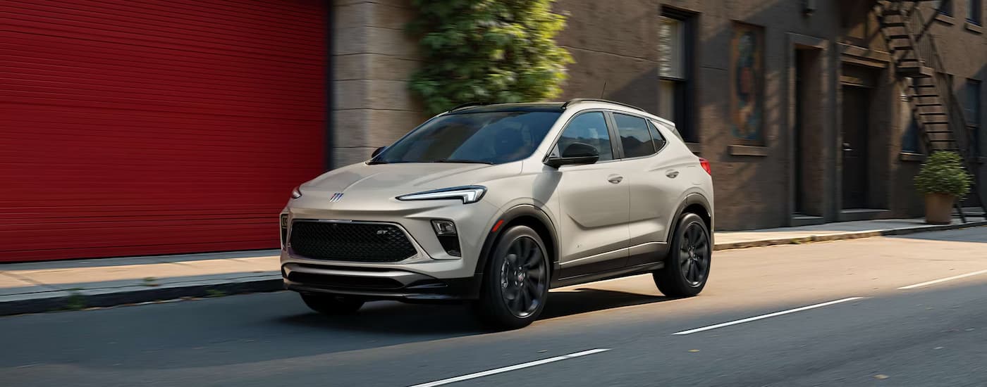 White 2026 Buick Encore GX driving on a city street