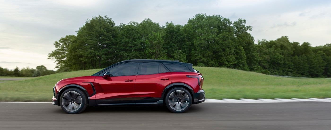 A red 2024 Chevy Blazer EV is shown on a racetrack after leaving a Chevy dealer near Port Huron.