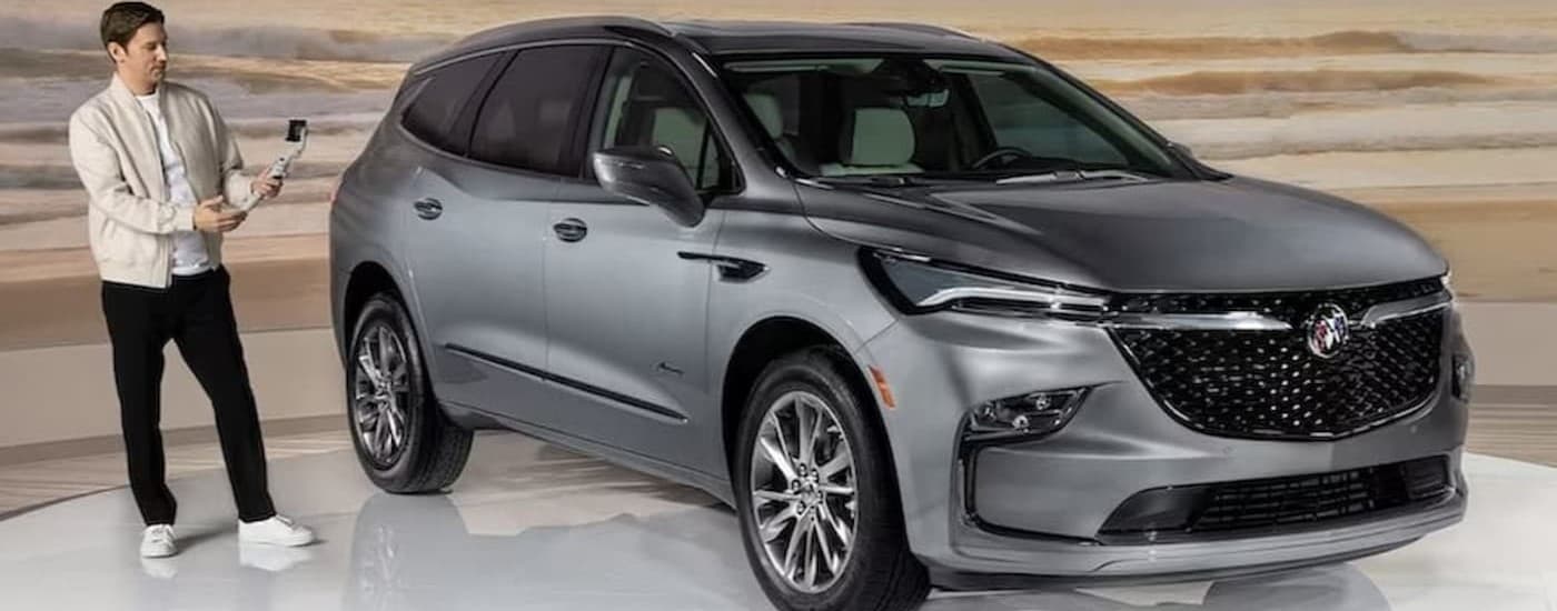 A silver 2023 Buick Enclave parked at a used Buick dealer near Chesterfield.