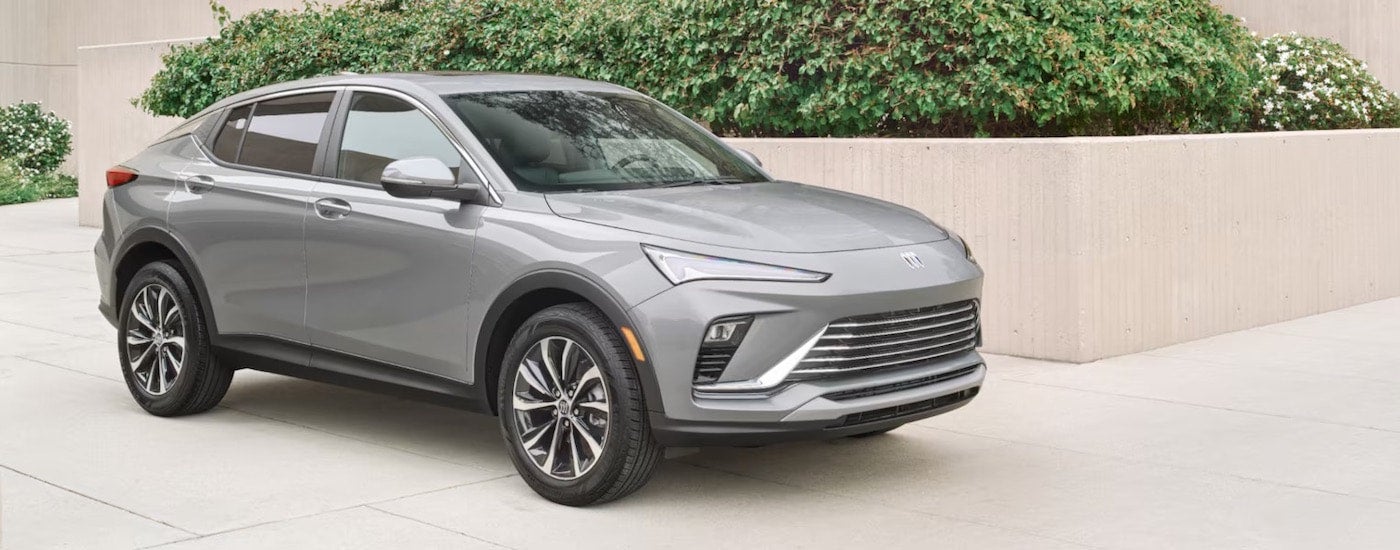 A silver 2024 Buick Envision from the side.